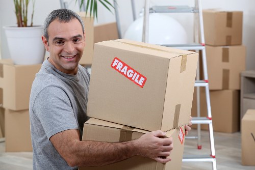 Packed office furniture ready for relocation in Westcombe Park