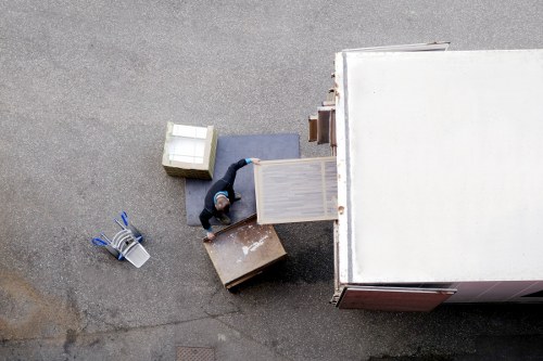 Loading furniture into a truck on a local residential street