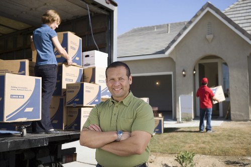 Furniture being carried by movers in Westcombe Park