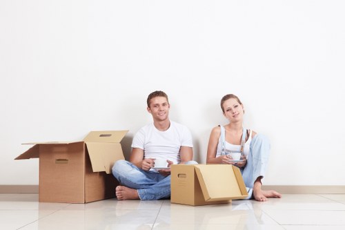 Professional movers navigating access in a Westcombe Park street
