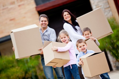 Professional movers carrying furniture for a home or office move