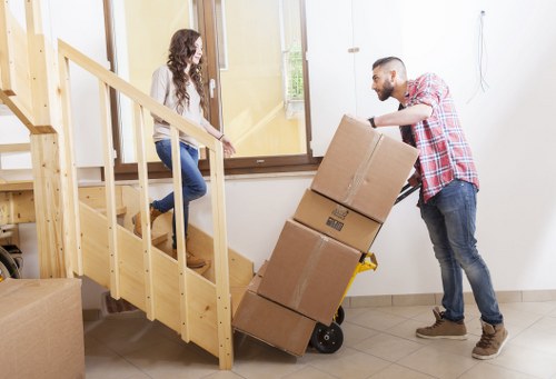 Local movers handling boxes and furniture near Westcombe Park